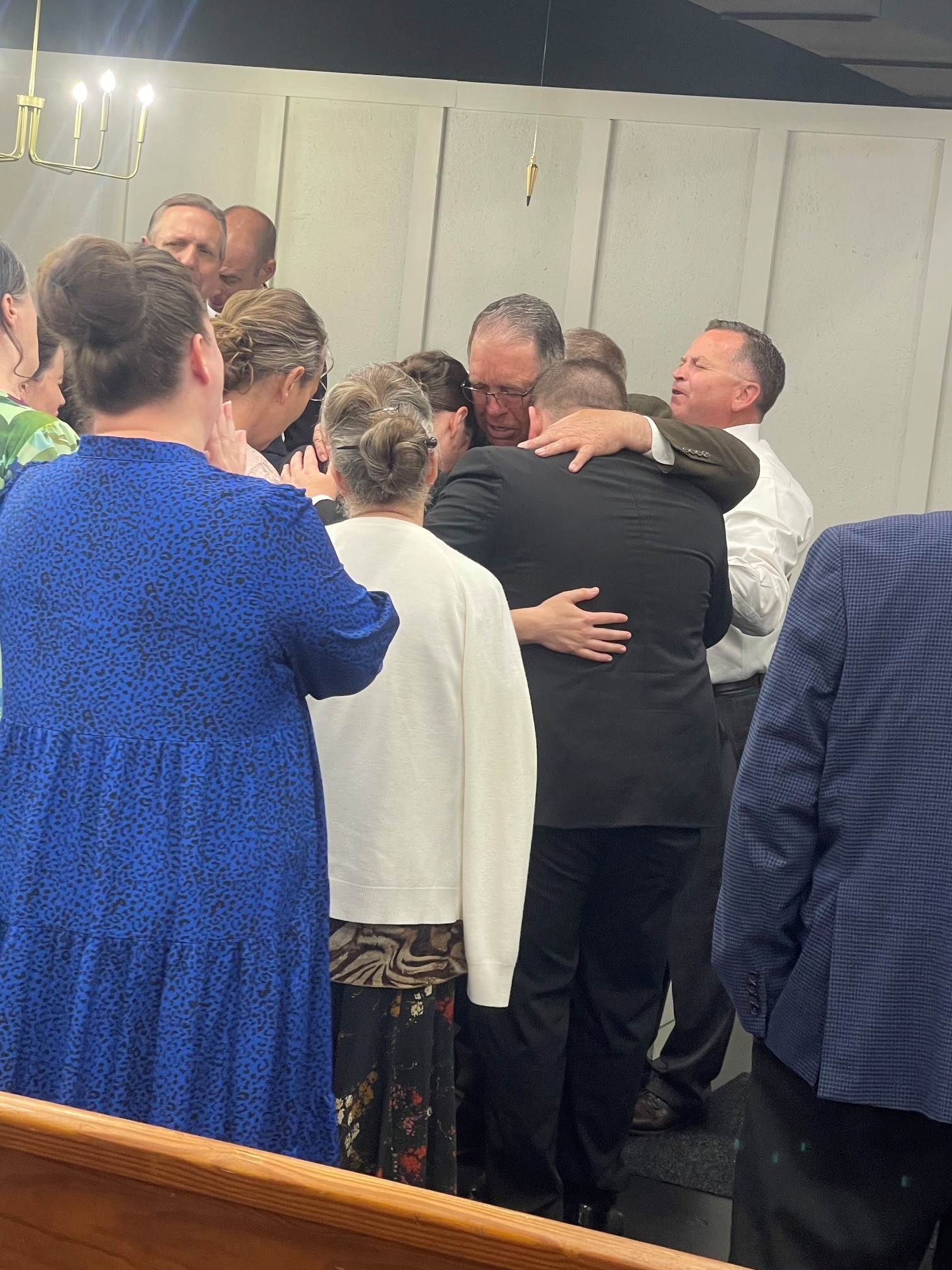 Church family gathered in prayer