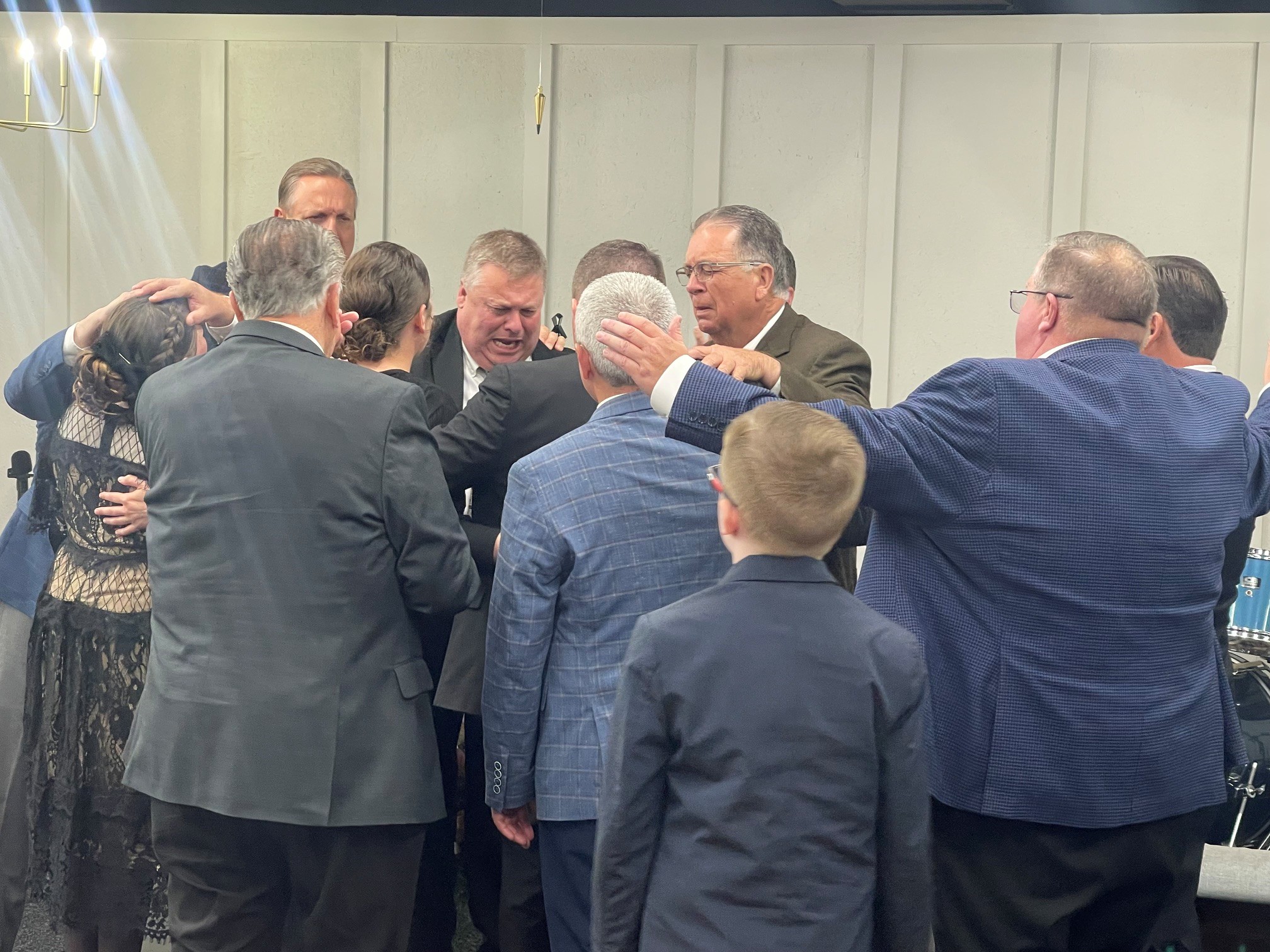 Church family gathered in prayer